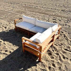 sectional sofa made of repurposed wood, off white cushions with outdoor fabric, medium brown wood color