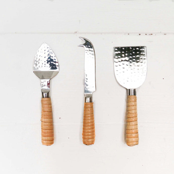 stainless steel cheese servers with rattan wrapped handles