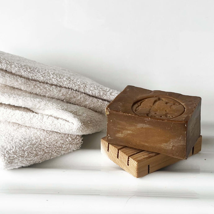 brown square French soap made with laurel oil