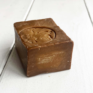 brown square French soap made with laurel oil