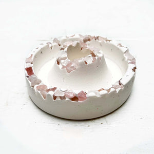 ceramic white taper candle holder with crushed rose quartz pieces