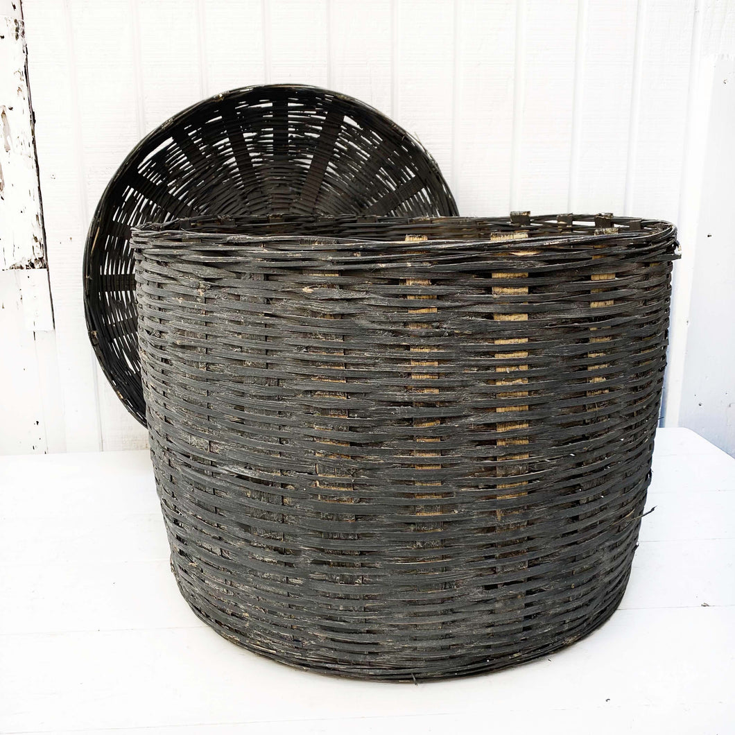 large charcoal colored basket with lid