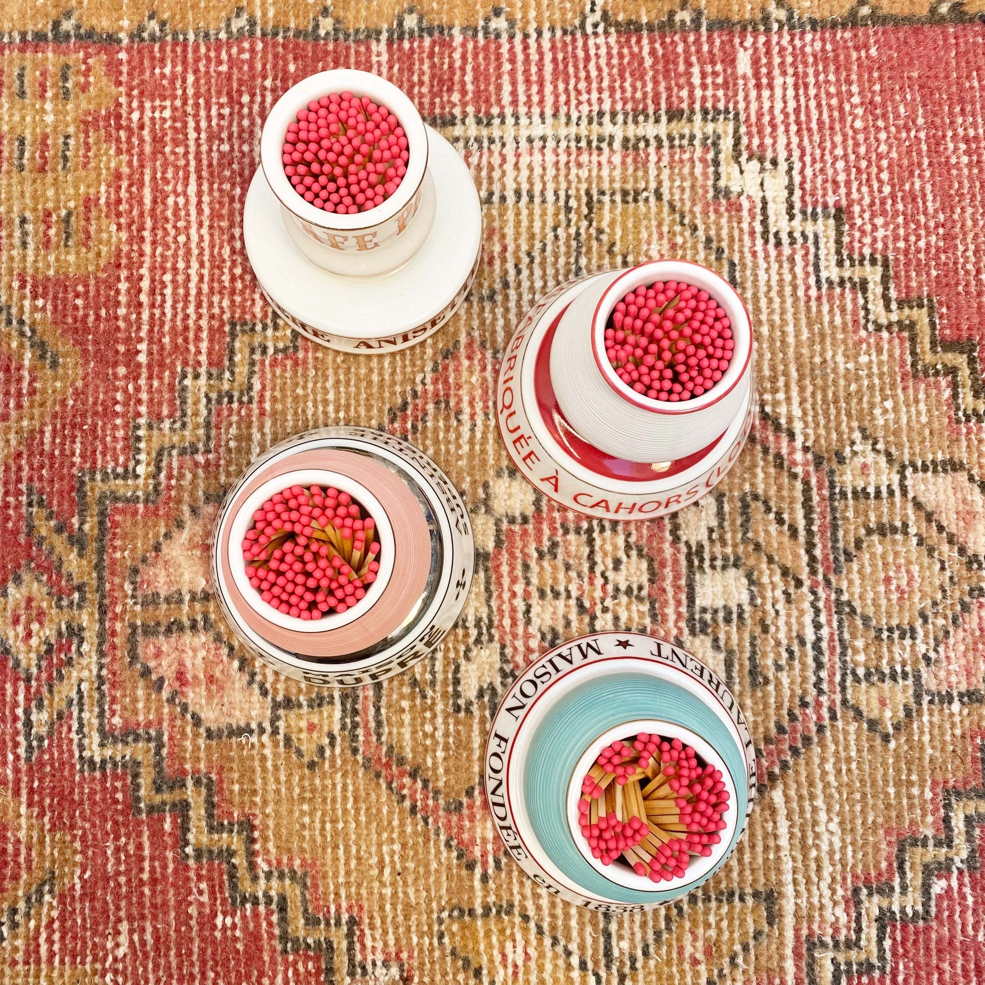 multiple colored ceramic match strike holders with French wording