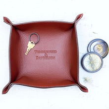 Load image into Gallery viewer, brown leather catch all tray with &quot;tumbleweed and dandelion&quot; embossed in the middle