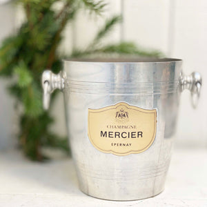silver ice bucket with brass plaque on front and French words