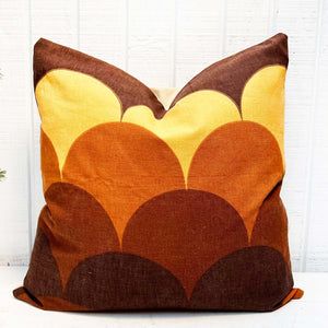 square pillow with yellow and brown pattern