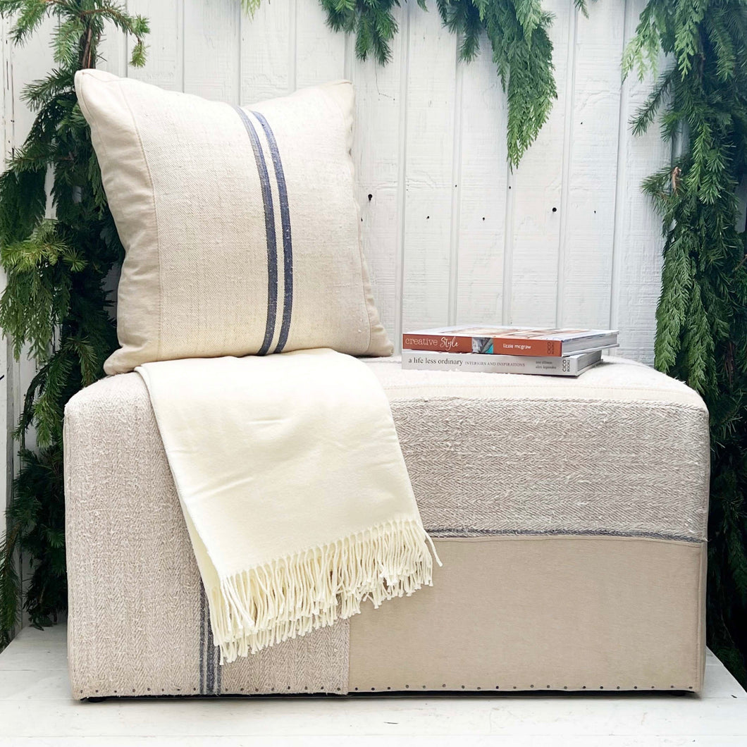 feed sack fabric upholstered rectangular ottoman with navy blue accent stripes
