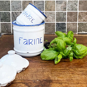 white vintage enamel spice jars with blue trim and blue French  text