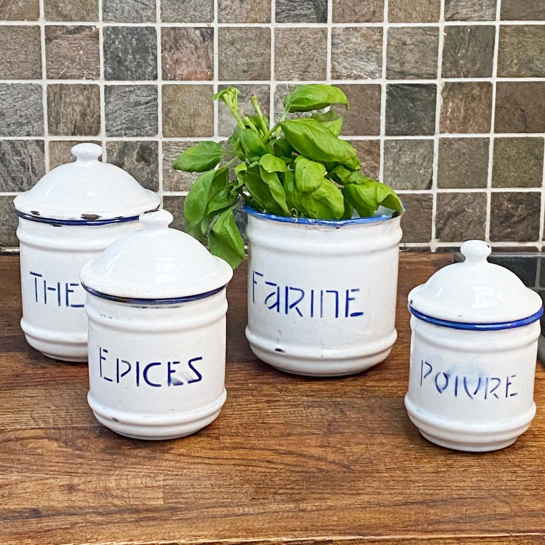 white vintage enamel spice jars with blue trim and blue French  text