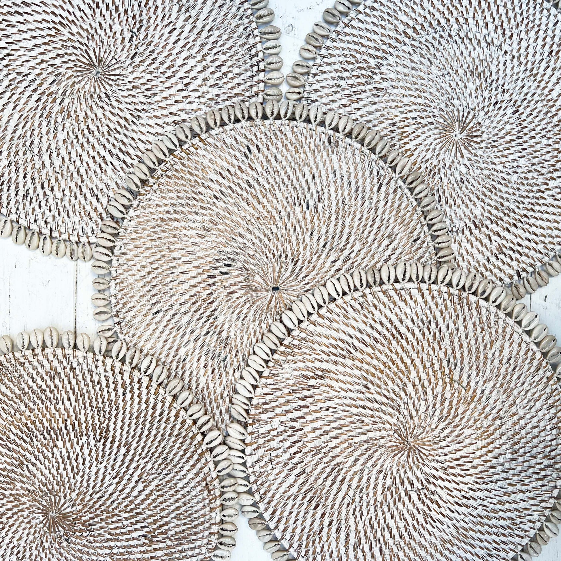 white wash rattan round placemat with off white shell on edge