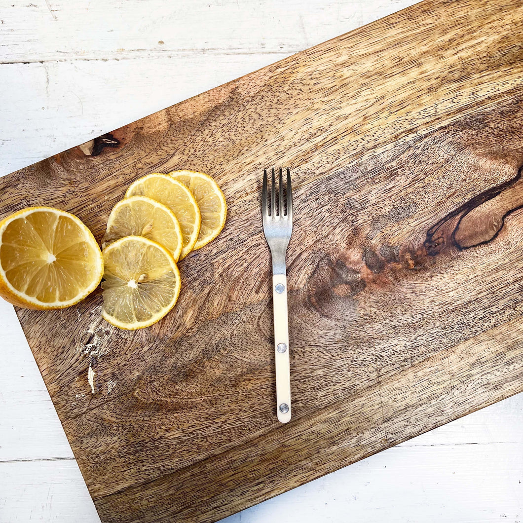 small serving fork with ivory colored handle