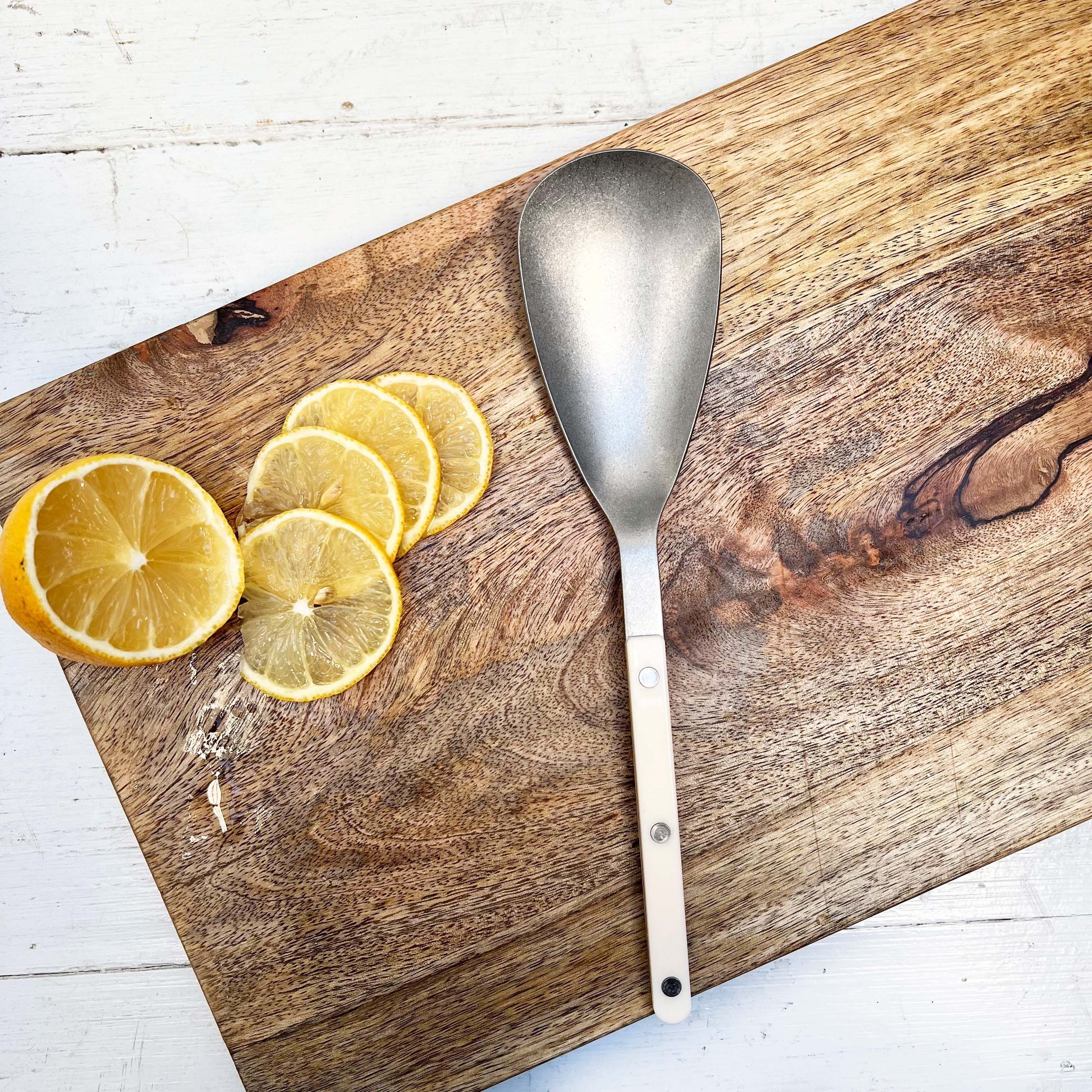 rice serving spoon with ivory colored handle