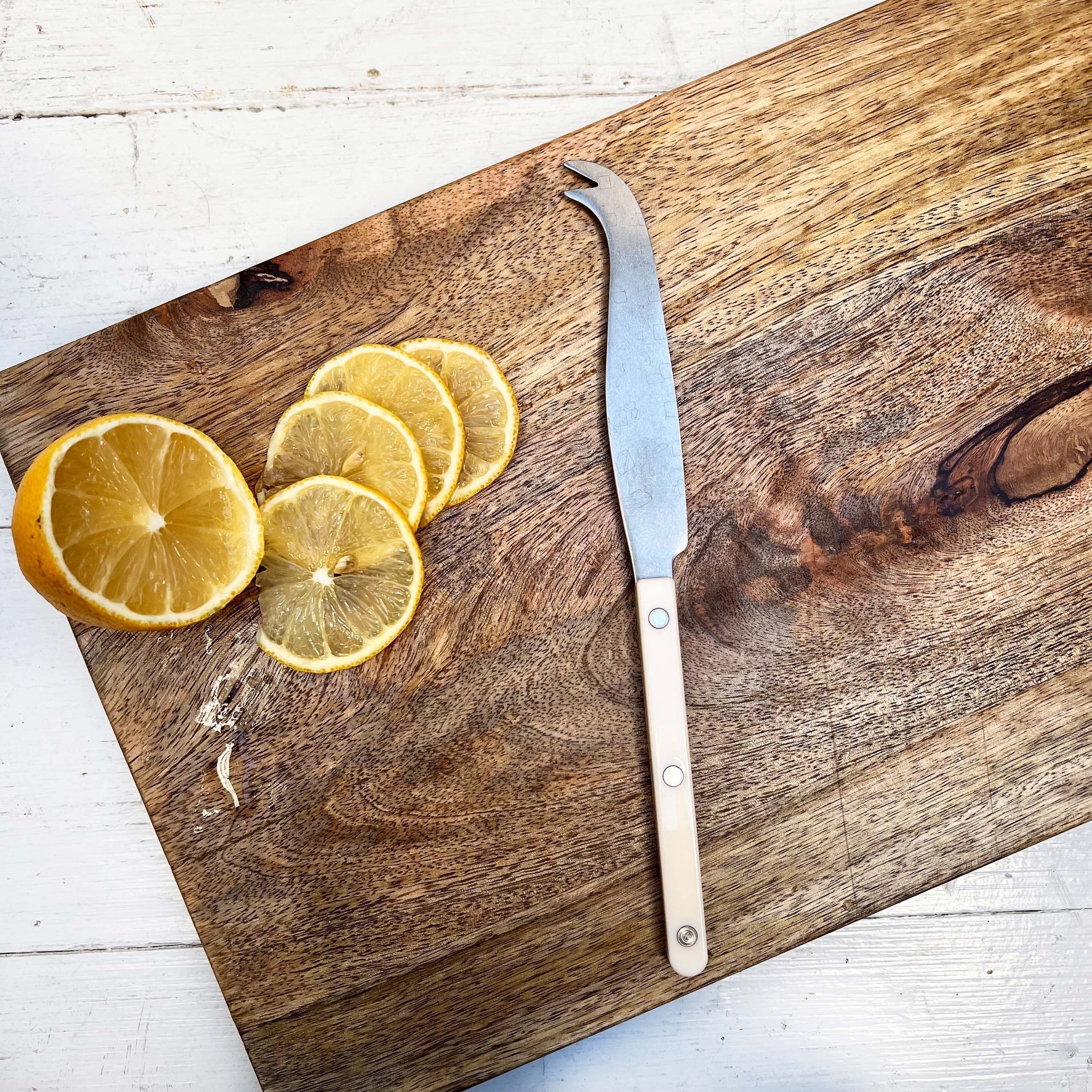 cheese knife with hook end and ivory colored handle