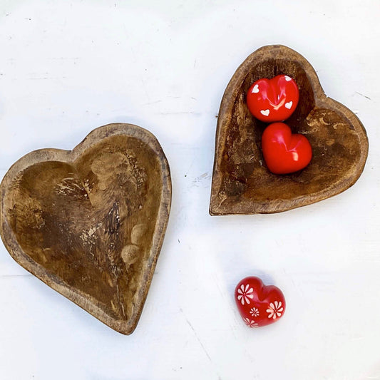 red hearts with patterns in white