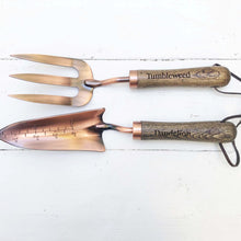 Load image into Gallery viewer, copper fork and trowel garden tool set with wooden handles imprinted with &quot;Tumbleweed&quot; on fork and &quot;Dandelion&quot; on the trowel
