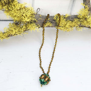 handmade green and gold beaded necklace with pendant