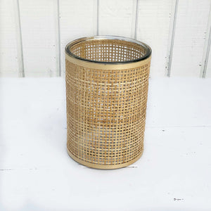 glass containers wrapped in wicker