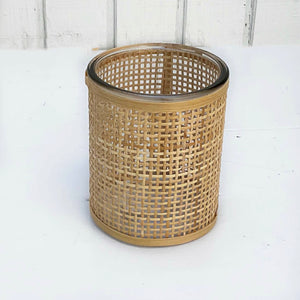 glass containers wrapped in wicker