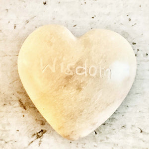 light colored heart shaped stones with inspirational words