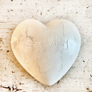 light colored heart shaped stones with inspirational words