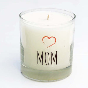 clear glass candle with MOM in black and a red heart