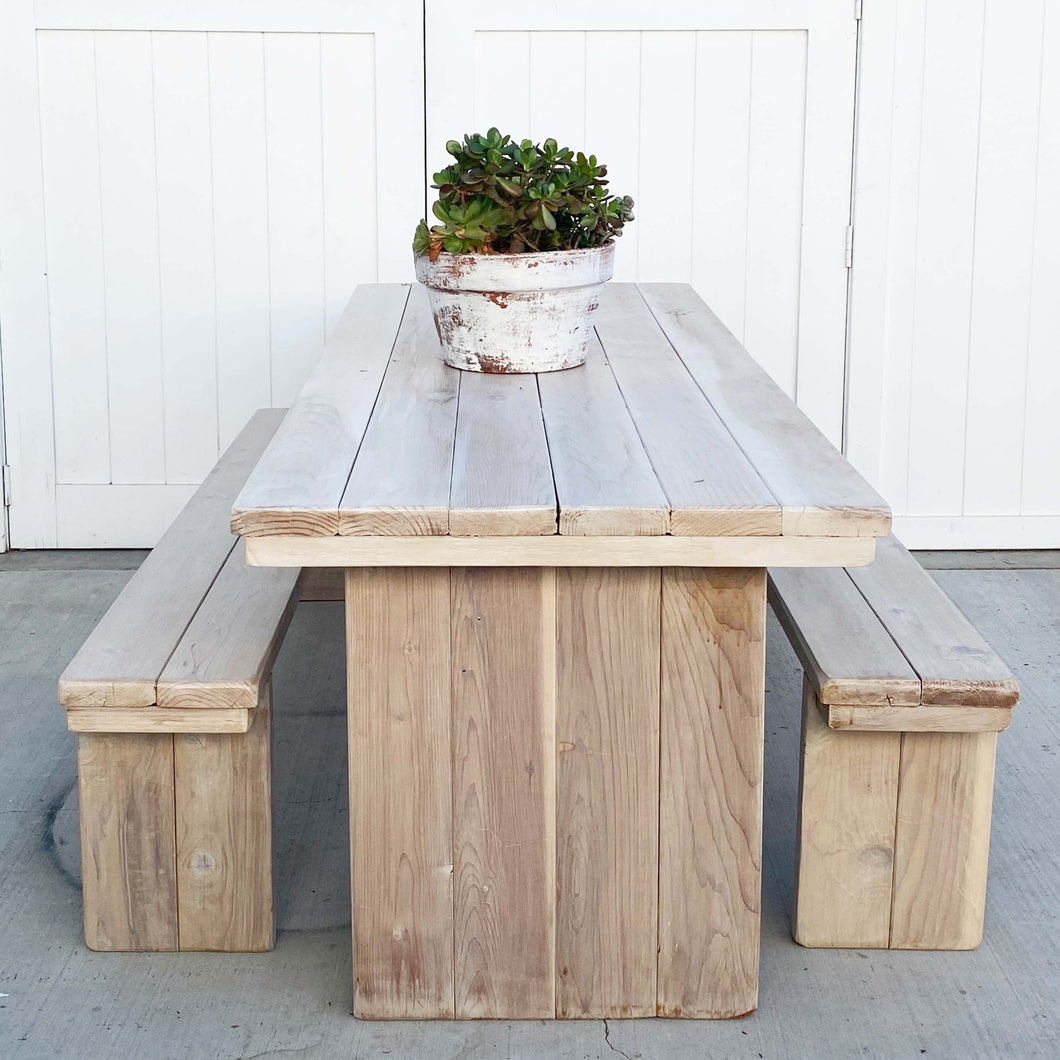 wood picnic table with planked top and two benches