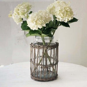glass canister vase wrapped in rattan