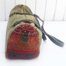 Load image into Gallery viewer, bags made from vintage military canvas, varying colors of army green, khaki and browns with dark leather straps