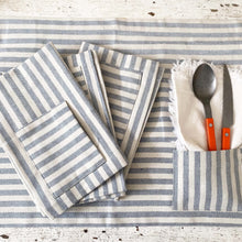Load image into Gallery viewer, spoon and knife with orange handles and striped placemats with pockets
