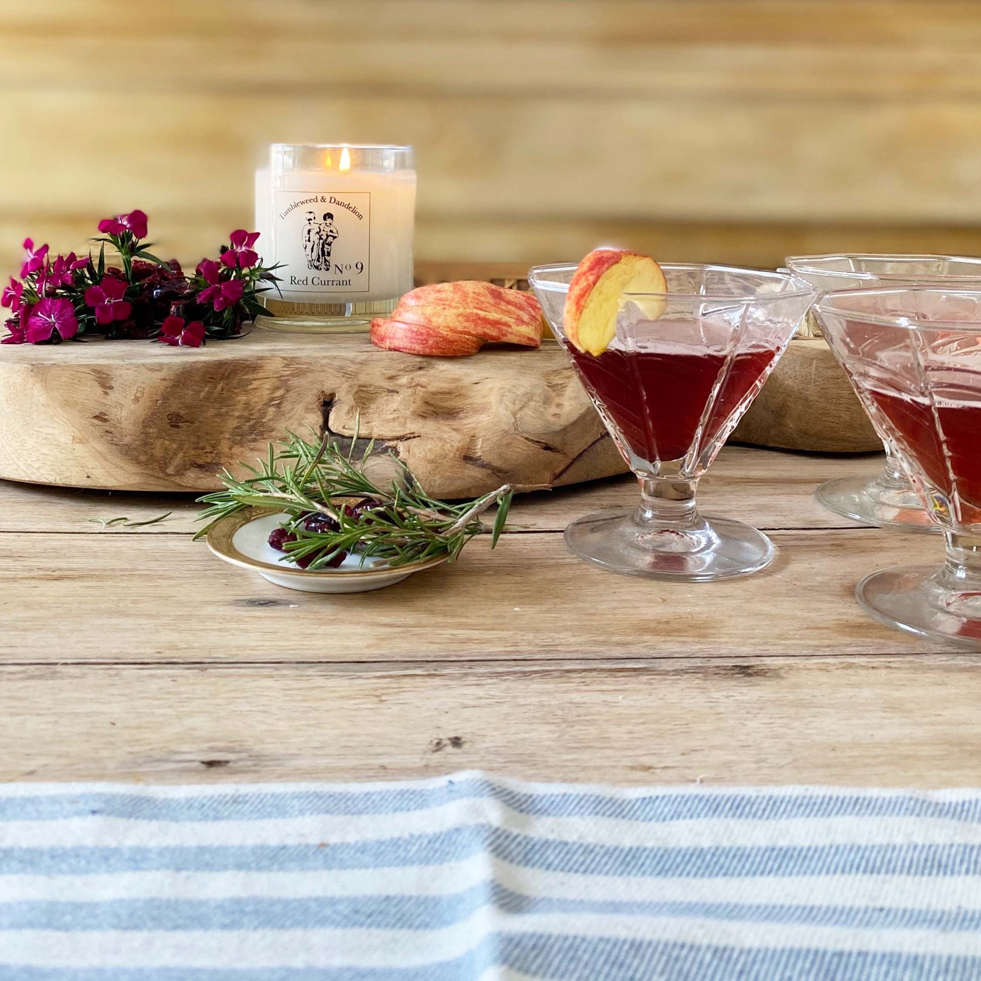 red currant scented candle in clear glass with black logo