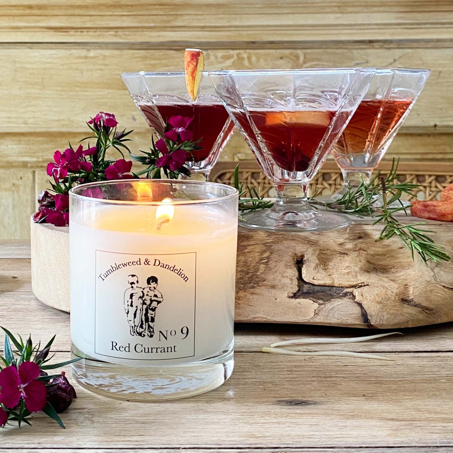 red currant scented candle in clear glass with black logo