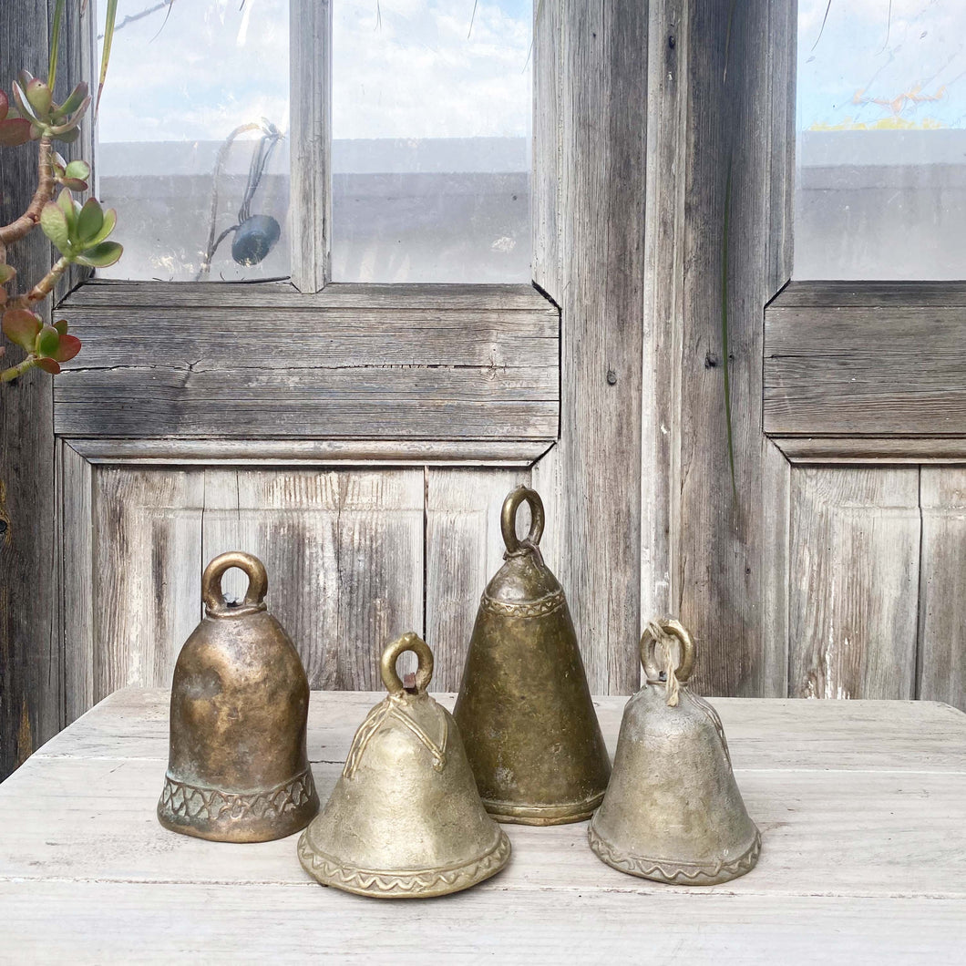 brass hand held dinner bells in varying sizes and  finishes