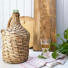 Load image into Gallery viewer, green glass wine jug wrapped in wicker with handle