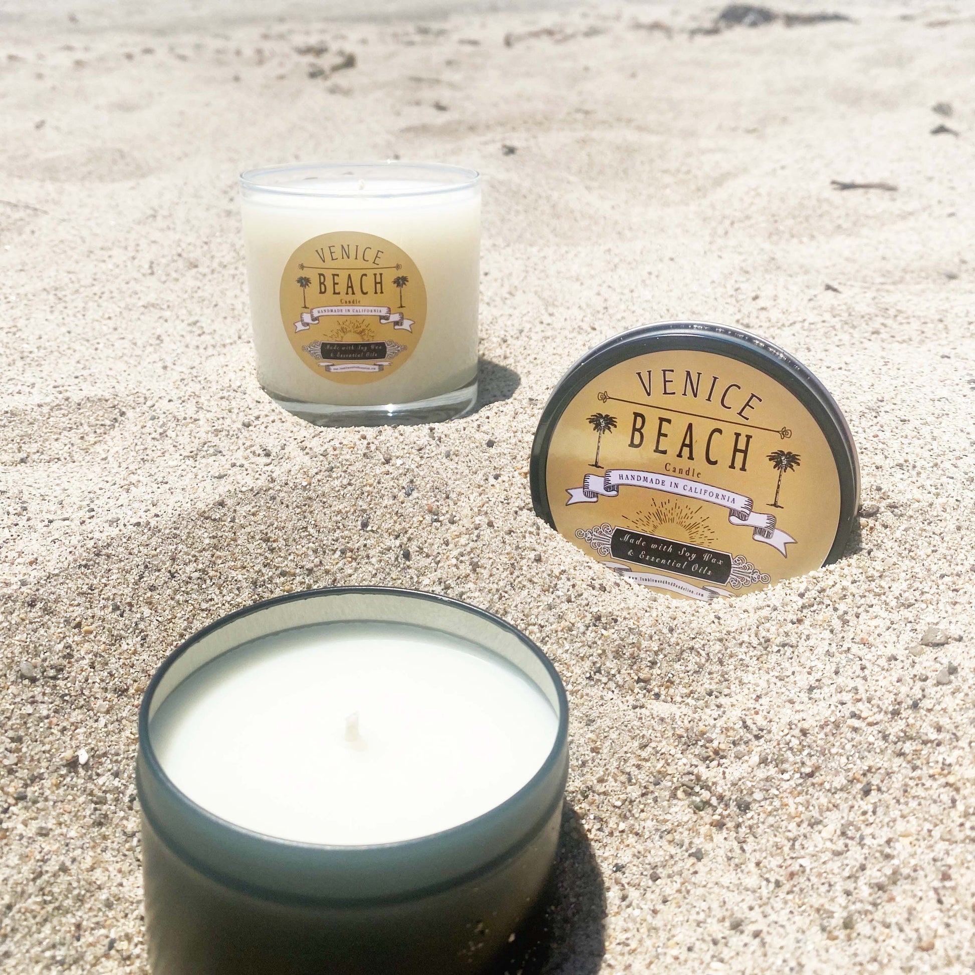 Black travel candle tin with Venice Beach logo on lid