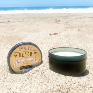 Black travel candle tin with Venice Beach logo on lid