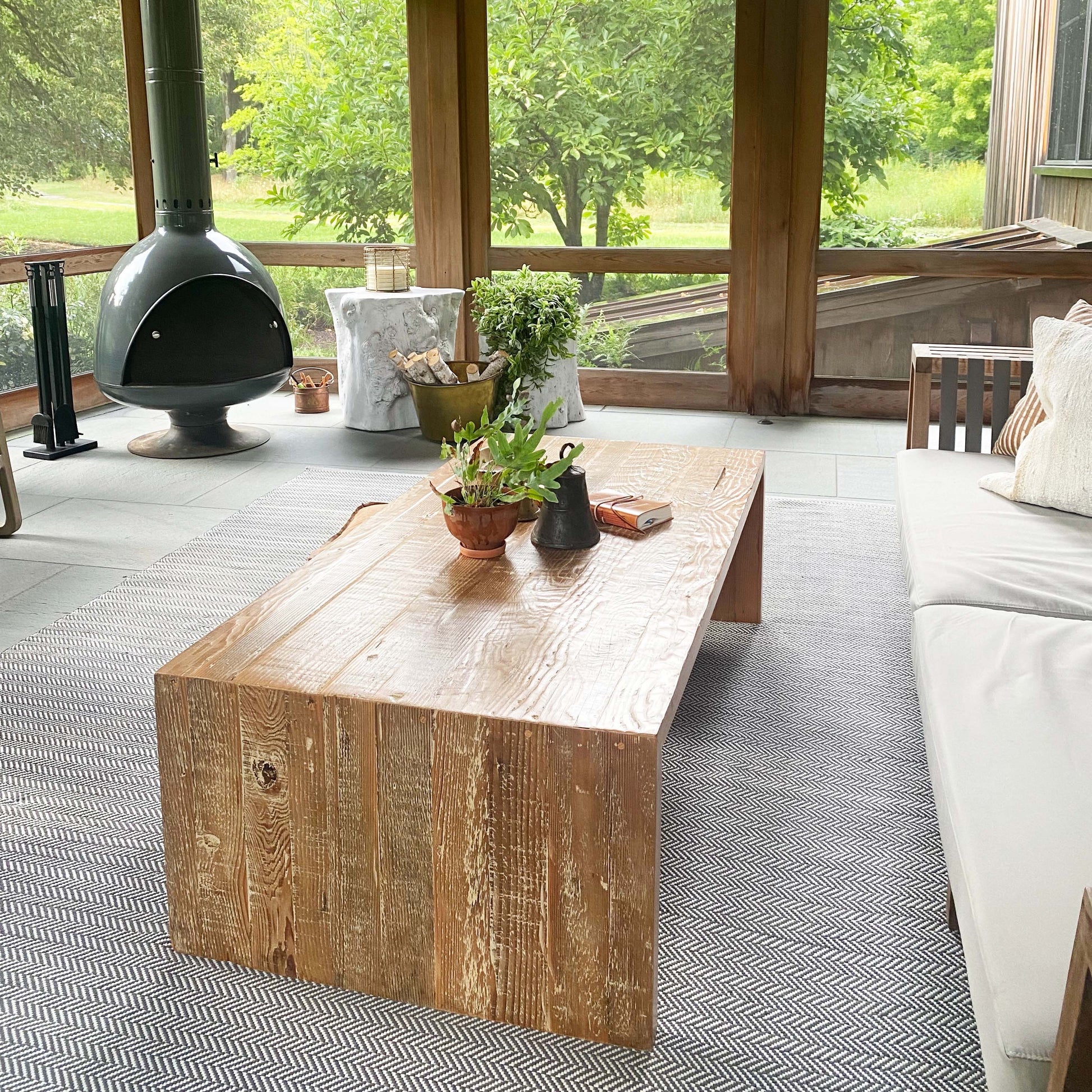 wood coffee table made of repurposed wood stained in medium brown color, open underneath...