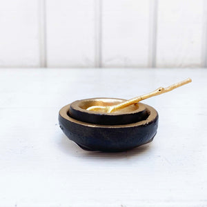 small gold dishes with spoon for salt and pepper