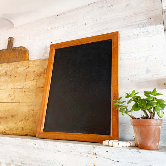 rectangular chalkboard with brown wood frame 
