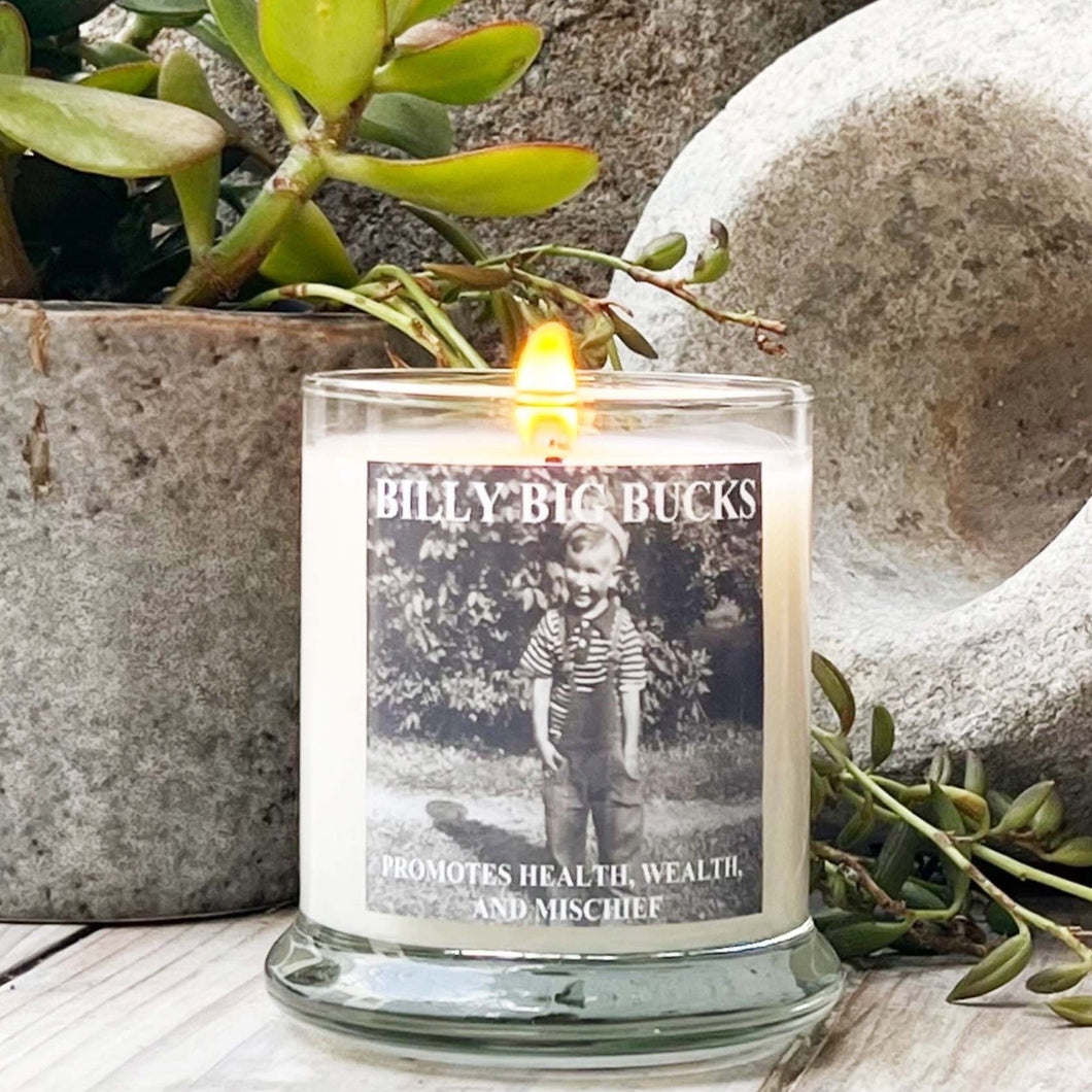 clear glass candle with lid and vintage black and white photo of little boy on label