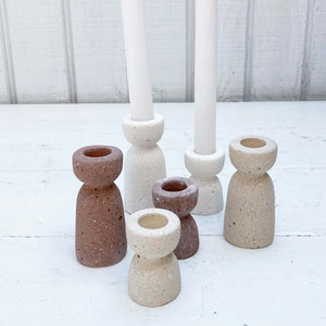 concrete hour glass shaped taper candle holders in varying colors