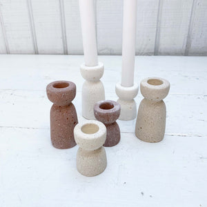 white concrete hour glass shaped taper candle holder