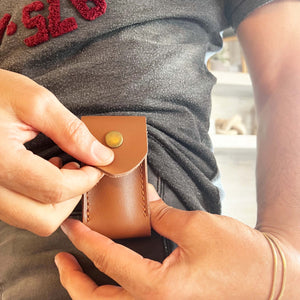pocket knife with multiple functions and  tan leather case