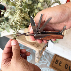 pocket knife with multiple functions and  tan leather case
