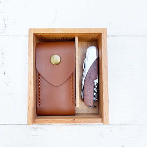 pocket knife with multiple functions and  tan leather case