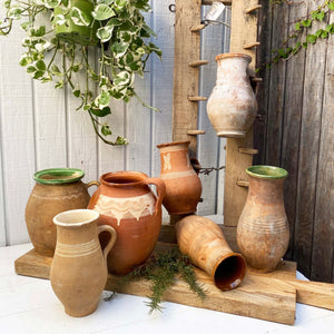 vintage terra cotta pitchers in varying shades and shapes