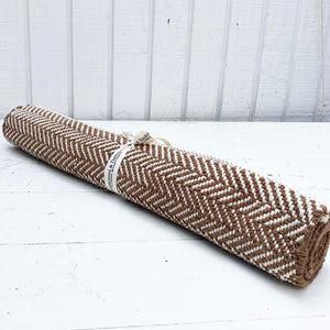 brown and cream herringbone patterned cotton rug