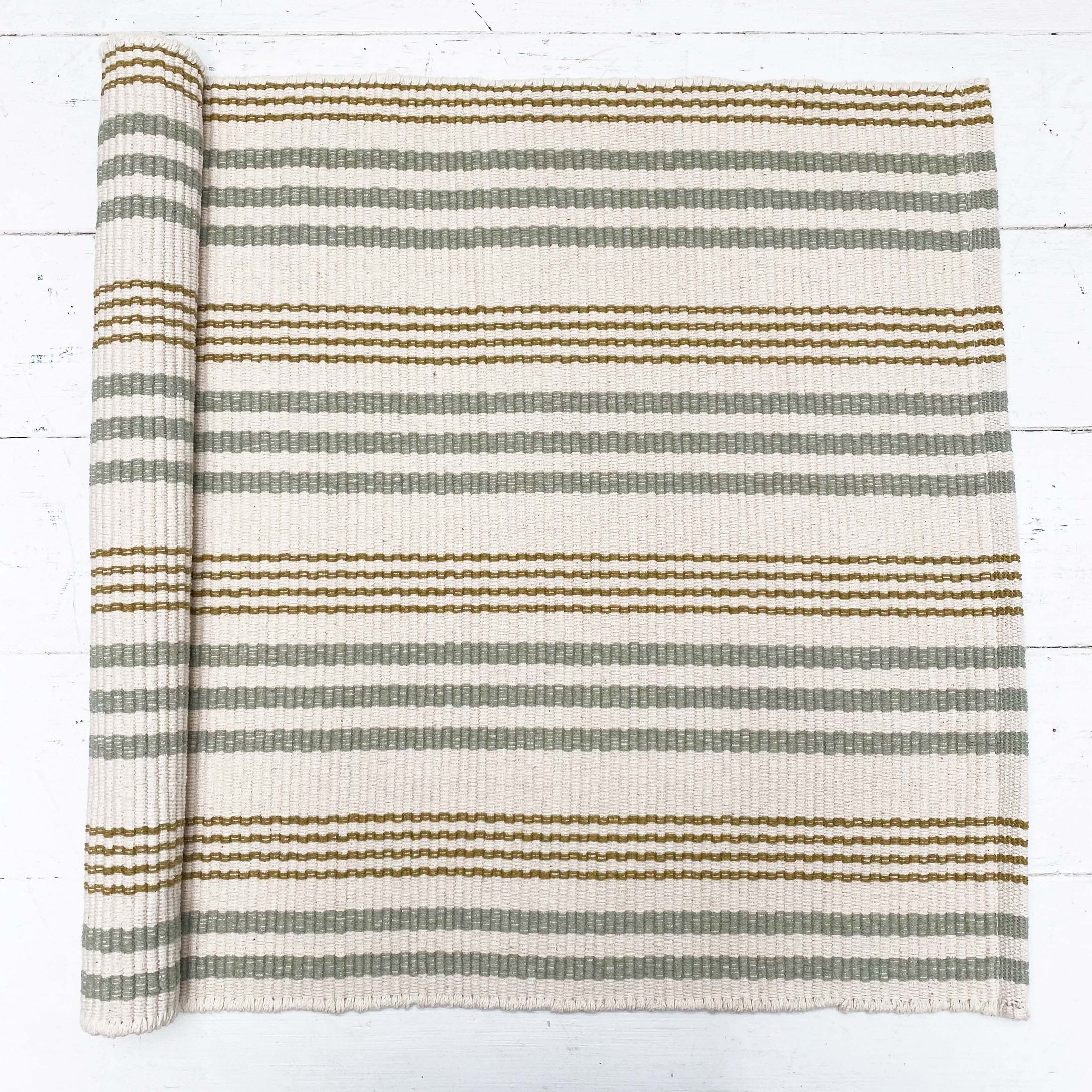 cream green and dark gold striped cotton rug