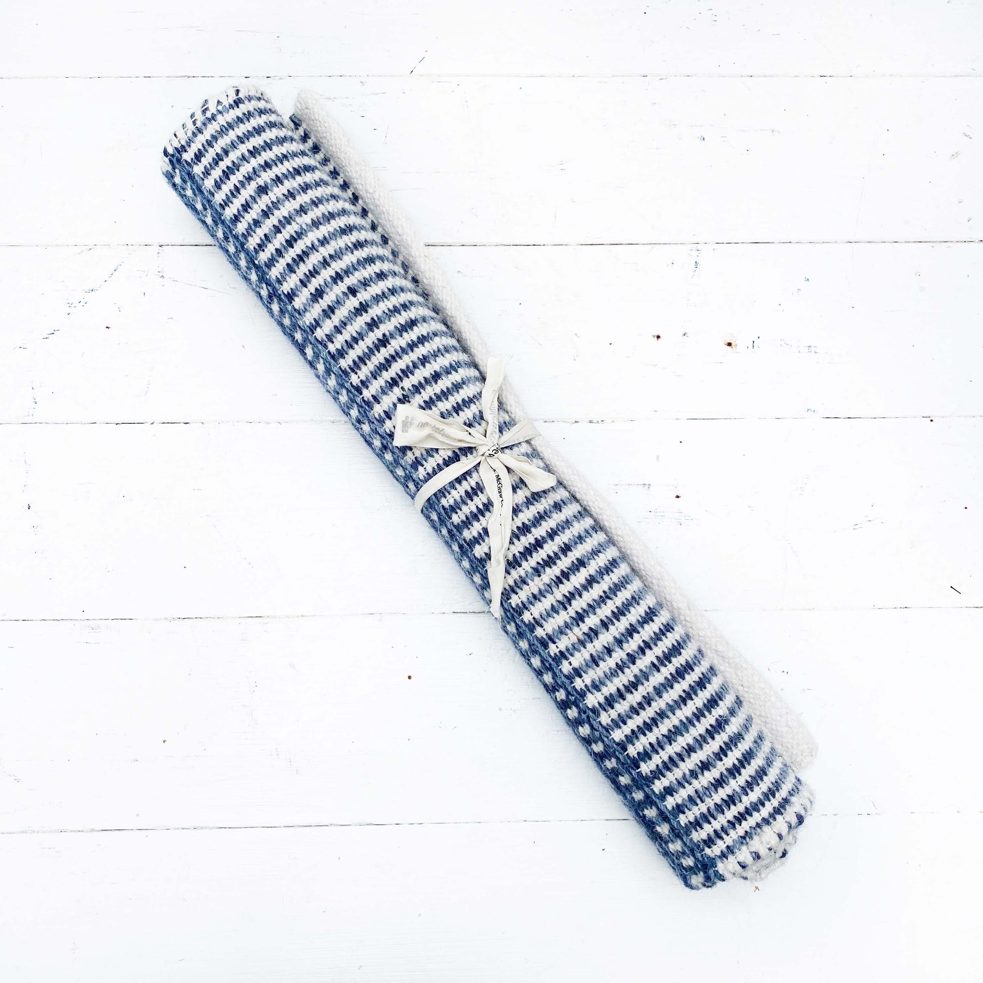 navy rug with white stripes