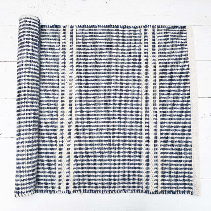 navy rug with white striped