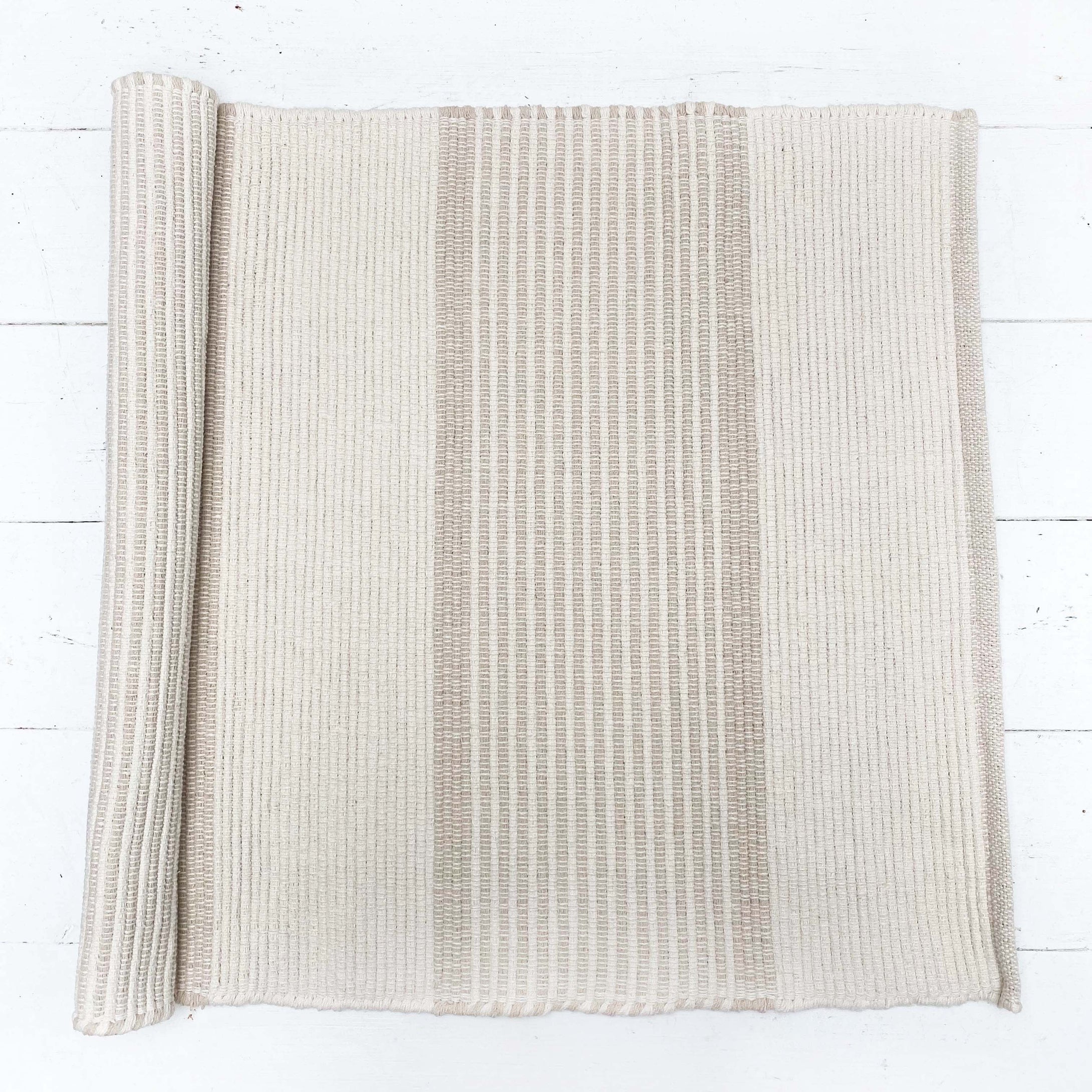 wheat and cream colored cotton rug